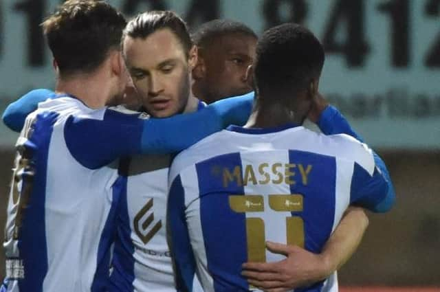 Will Keane celebrates scoring at Morecambe