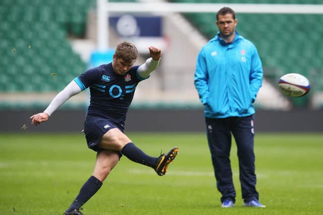 Owen Farrell practices his kicking watched on by dad, Andy