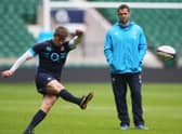 Owen Farrell practices his kicking watched on by dad, Andy