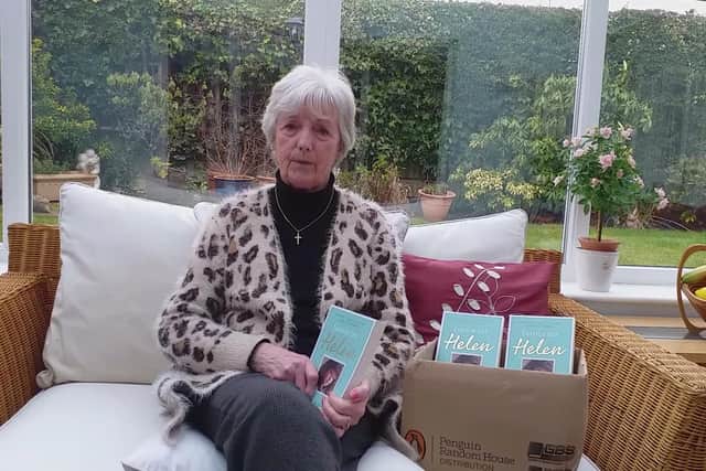 Marie McCourt with her new book