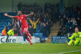 Tendayi Darikwa celebrates Latics' 2-0 victory at Gillingham back in October