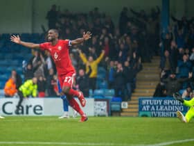 Tendayi Darikwa celebrates Latics' 2-0 victory at Gillingham back in October