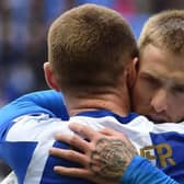 Max Power congratulates Stephen Humphrys after Latics' second goal