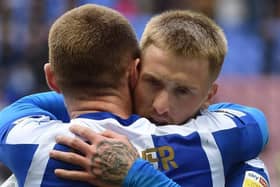 Max Power congratulates Stephen Humphrys after Latics' second goal