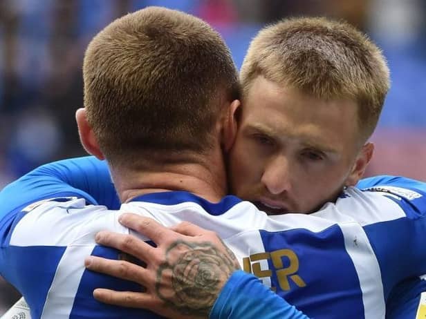 Max Power congratulates Stephen Humphrys after Latics' second goal
