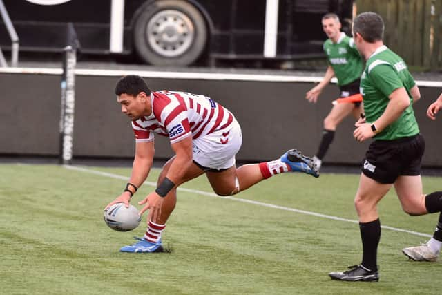 Patrick Mago goes over for Wigan (Credit: Bernard Platt)