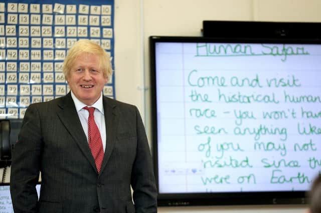 Prime Minister Boris Johnson joining a socially distanced lesson during a visit to Bovingdon Primary School in Hertfordshire on June 19, 2020. Boris Johnson was facing fresh allegations of breaking coronavirus rules after it emerged a gathering to wish him a happy birthday was held inside No 10 during the first lockdown