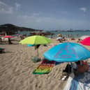 SPAIN: Tourists enjoy a sunny day at Cala Tadira beach. Photo: Getty Images