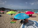 SPAIN: Tourists enjoy a sunny day at Cala Tadira beach. Photo: Getty Images
