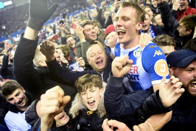 Dan Burn celebrates Latics' famous FA Cup victory over Manchester City in 2018