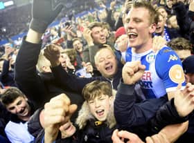 Dan Burn celebrates Latics' famous FA Cup victory over Manchester City in 2018
