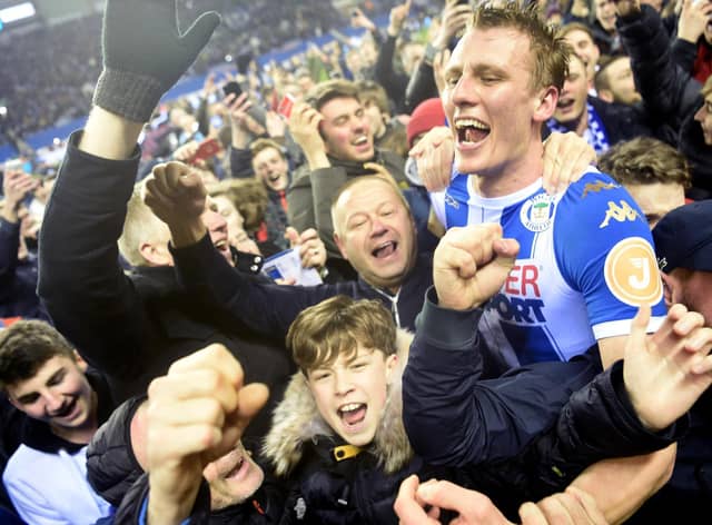 Dan Burn celebrates Latics' famous FA Cup victory over Manchester City in 2018