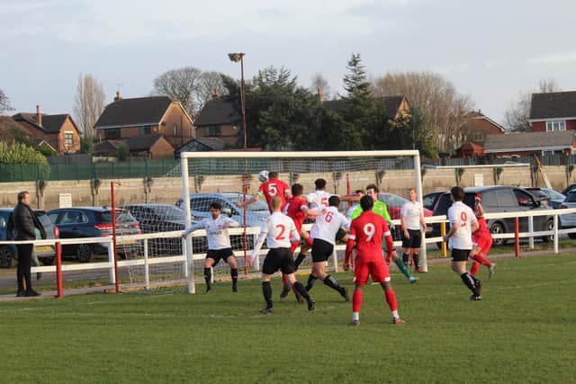 Alex Noonon heads home for Ashton Town (Pic: Gordon Johnson)