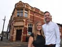 Rachael and Kai Binder outside the site for the pizza restaurant