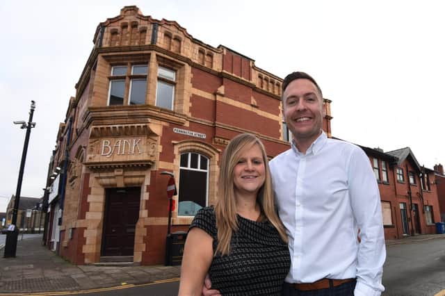 Rachael and Kai Binder outside the site for the pizza restaurant