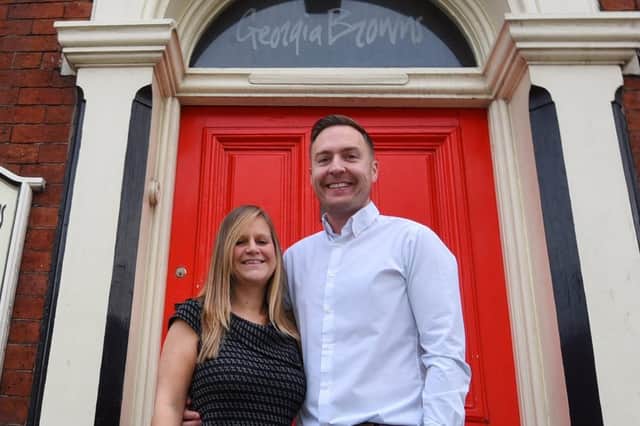 Rachael and Kai Binder outside the site for a new sports bar