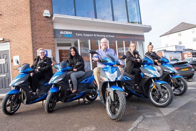 Robin Bamber, Holly Beddoe, Andy Boardman, Vanessa Collins and Sophier Emmerson on the new mopeds