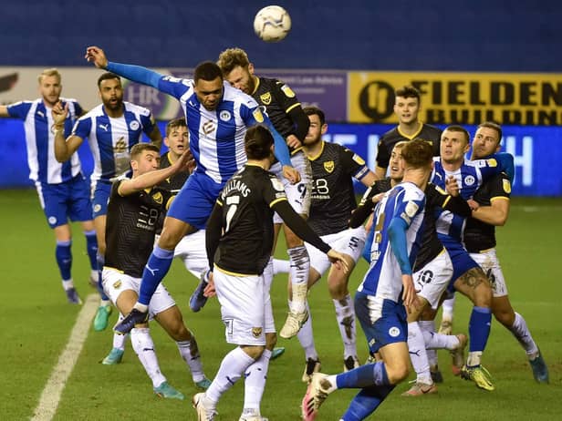 Josh Magennis heads for goal
