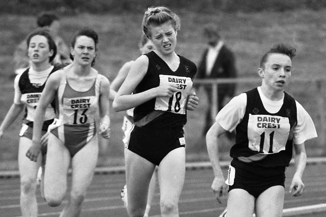 A one, two, three coming up for Wigan Harriers in the Minors 800 metres as Tracy Gobin, Charlotte Lomas and Emma Daly pass the opposition down the home straight in the Northern Counties Championships at Robin Park on Sunday 26th of May 1991.