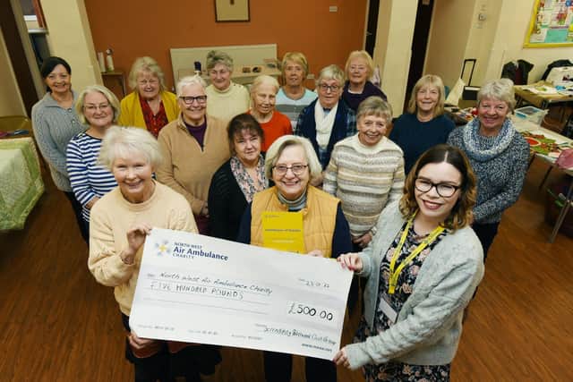Members of Serendipity Quilters, present a £500 cheque to Laura Carr, right, South Lancashire regional fund raiser at North West Air Ambulance Charity