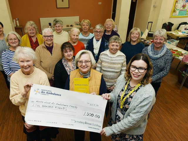 Members of Serendipity Quilters, present a £500 cheque to Laura Carr, right, South Lancashire regional fund raiser at North West Air Ambulance Charity