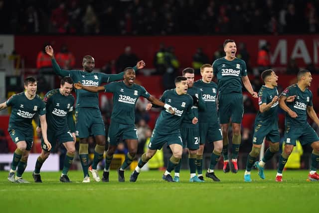 Middlesbrough players celebrate winning the penalty shoot-out after the Emirates FA Cup fourth round match at Old Trafford, Manchester.