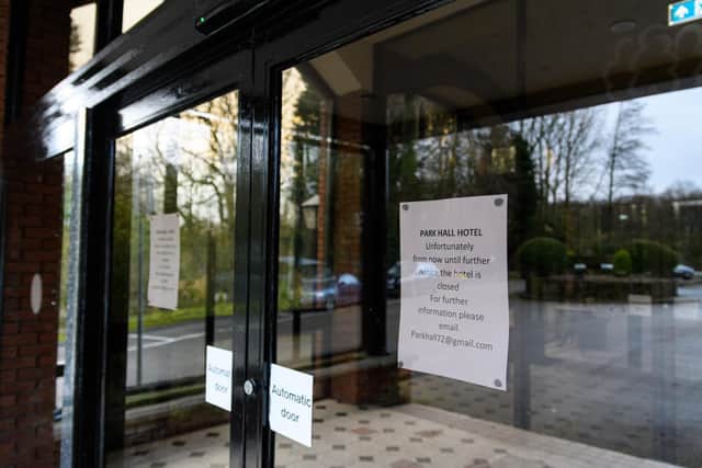 A sign on the door tells visitors the hotel has now closed until further notice