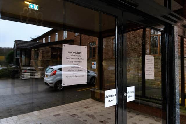 A sign on the door tells visitors the hotel has now closed until further notice