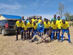 The Kenyan kids show off their new yellow kit!