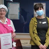 Jo Carby, chief executive of Wigan and Leigh Hospice, congratulates Maureen Shaw
