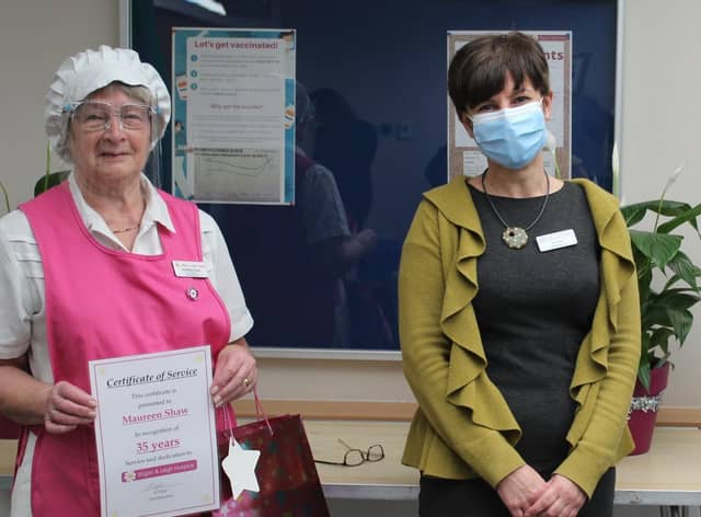 Jo Carby, chief executive of Wigan and Leigh Hospice, congratulates Maureen Shaw