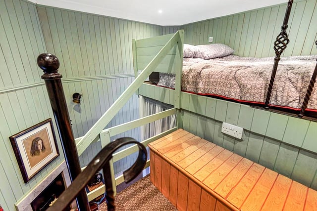 Inside is the entrance to the ground floor living and the bedroom with a mezzanine bed area and plenty of storage.