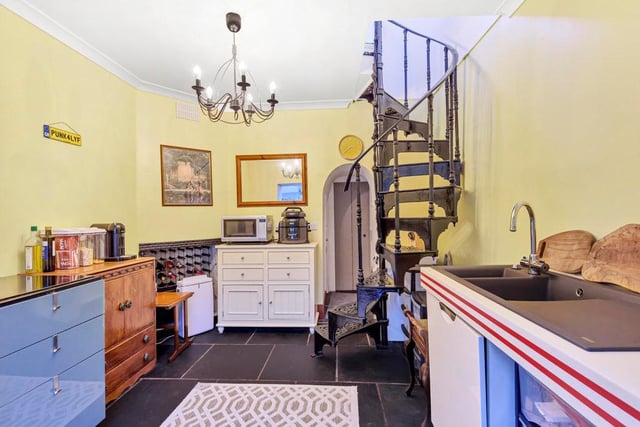 Spiral stairs then take you to the under ground living accommodation which boasts a living area with glass roof.