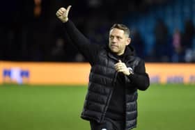 Leam Richardson salutes the travelling Latics fans at Sheffield Wednesday in midweek