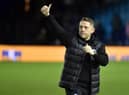 Leam Richardson salutes the travelling Latics fans at Sheffield Wednesday in midweek