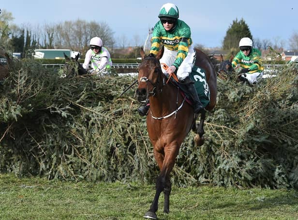 Rachael Blackmore rides Minella Times to victory in the Grand National