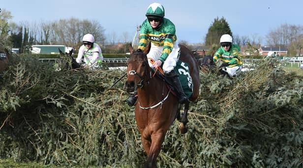 Rachael Blackmore rides Minella Times to victory in the Grand National