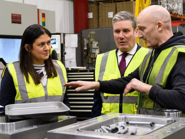 Lisa Nandy MP and Labour leader Sir Keir Starmer chat with a worker at What More