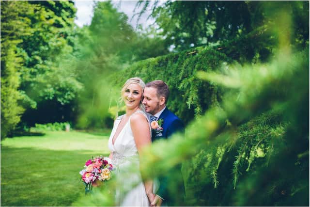 A happy couple in the garden at Kilhey Court