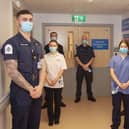 Left to right: Royal Navy personnel with Student Nurse Chloe Johnson, Richard Fitchett (centre) and HCA Johanna Mazar