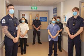 Left to right: Royal Navy personnel with Student Nurse Chloe Johnson, Richard Fitchett (centre) and HCA Johanna Mazar