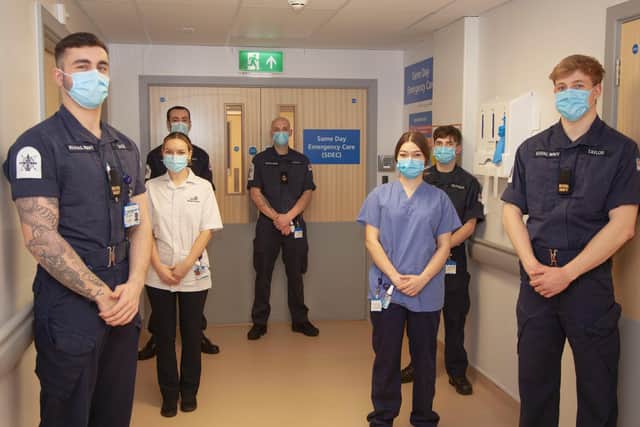 Left to right: Royal Navy personnel with Student Nurse Chloe Johnson, Richard Fitchett (centre) and HCA Johanna Mazar