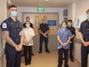 Left to right: Royal Navy personnel with Student Nurse Chloe Johnson, Richard Fitchett (centre) and HCA Johanna Mazar