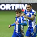 Callum Lang gets the congratulations after netting against Crewe