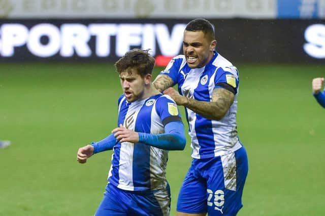 Callum Lang gets the congratulations after netting against Crewe