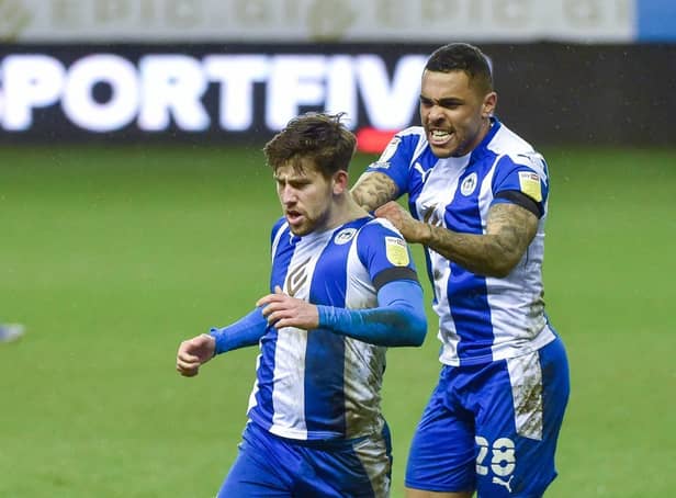 Callum Lang gets the congratulations after netting against Crewe