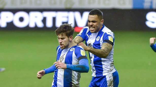 Callum Lang gets the congratulations after netting against Crewe