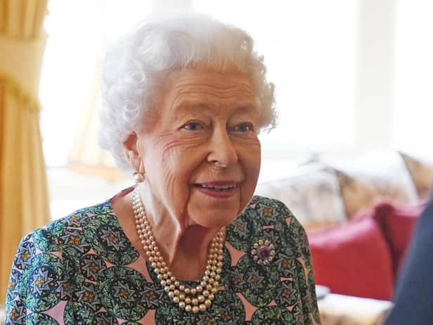 The Queen has tested positive for Covid-19 and is experiencing "mild cold-like symptoms, confirms Buckingham Palace, but expects to continue light duties at Windsor this week. Picture by Steve Parsons. Credit: PA Wire/PA Images