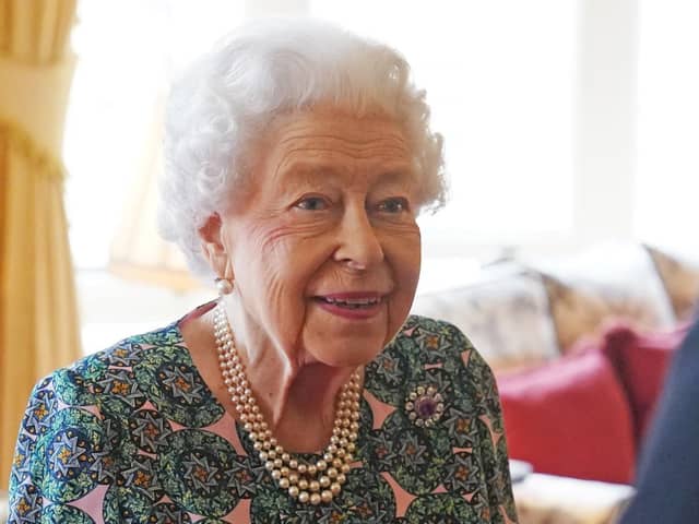The Queen has tested positive for Covid-19 and is experiencing "mild cold-like symptoms, confirms Buckingham Palace, but expects to continue light duties at Windsor this week. Picture by Steve Parsons. Credit: PA Wire/PA Images