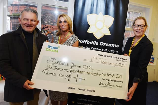 Coun Lawrence Hunt and councillor supporting officer Paula Clisham present a £6,650 cheque from Brighter Borough funding to Maureen Holcroft at Daffodils Dreams